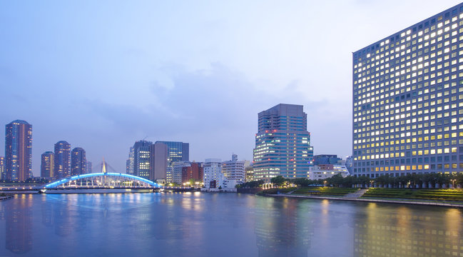 Tokyo city view with highrise building and sumida river in evening..