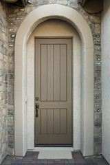 Front wooden door with stone, front view and closeup