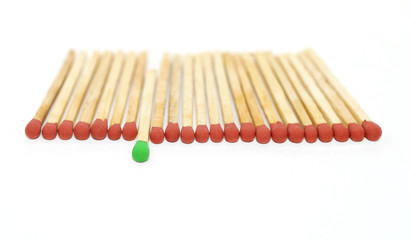 one matchstick standing out from other
