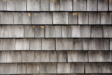 rows of weathered wood shingles on barn