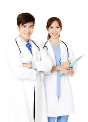 Fototapeta premium Confident male and female doctors standing together