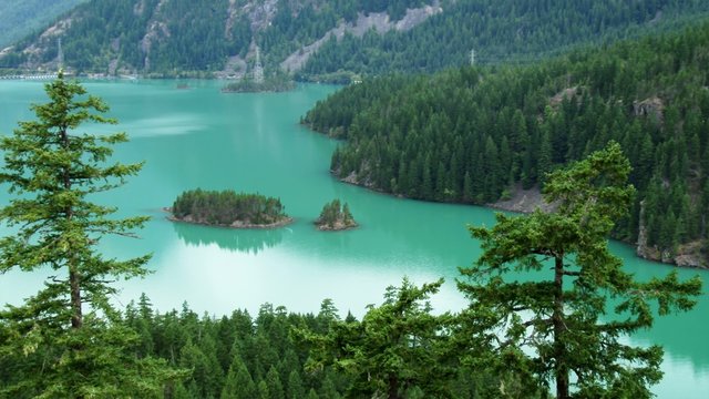 Sweeping scene of Diablo Lake full of little islands in North Cascades National Park, 4K, Ultra HD