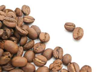 heap of coffee beans on white