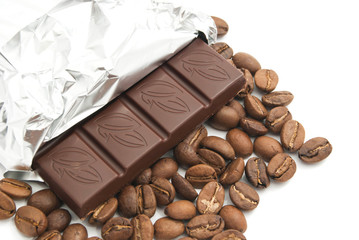 chocolate and heap of coffee beans on white