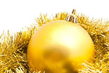 christmas tree toy and gold tinsel on white