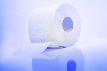 White roll of toilet paper in a blue tone.