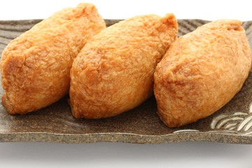 Fototapeta premium Sushi In Fried Tofu On White Background