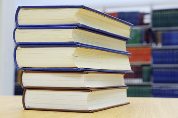 stacking books on library desk