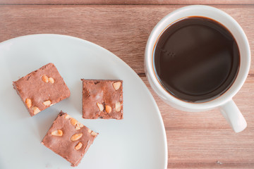 brownies with cup of coffee on table