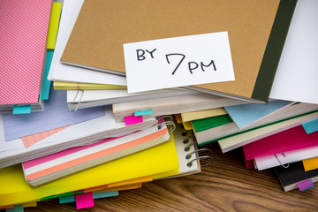 By 7 PM; The Pile of Business Documents on the Desk