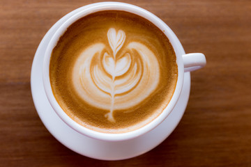 art latte coffee on white cup