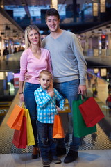 young family with shopping bags