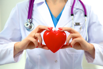 Close-up of unknown female doctor with stethoscope isolated