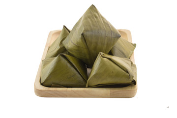 Stuffed Dough Pyramid :  dessert made from sticky rice flour and palm sugar wrapped with banana leaf 