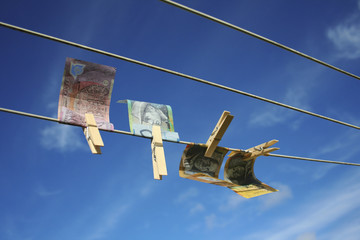Australian notes pegged on washing line. Money laundering concept.