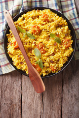 sweet rice with dried apricots and raisins close-up. vertical top view
