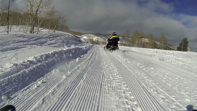Snowmobile ride high mountain forest trail HD 1004
