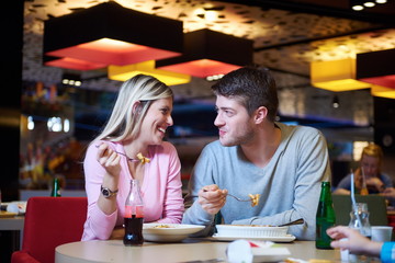 couple having lunch break in shopping mall