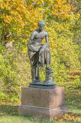 Sculpture in the Catherine Park against the backdrop of autumn trees, Pushkin (Tsarskoe Selo), Russia.