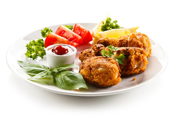 Roasted chicken drumsticks and vegetables 