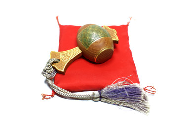 mallet of luck on the red Japanese cushion