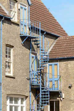 Spiral staircase fire escape outside property