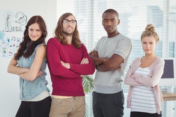 Portrait of business team with arms crossed 