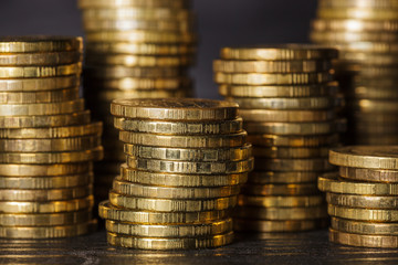 Stacks of gold coins on black background