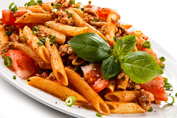 Penne with meat, tomato sauce and vegetables 