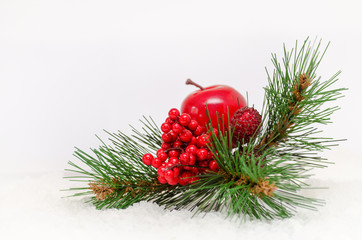 Christmas background with red berries, apple and christmastree