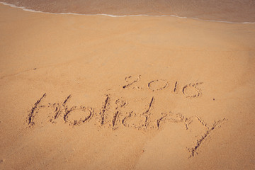 Holiday 2016 handwriting on sand