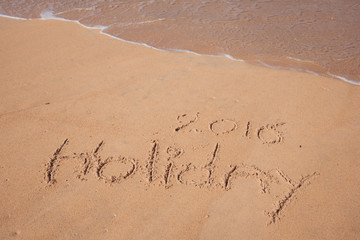 Holiday 2016 handwriting on sand