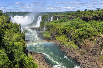 Fototapeta na wymiar Rainbow at Devil's Throat at Iguazu Falls, Brazil