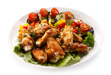 Grilled chicken wings and vegetables