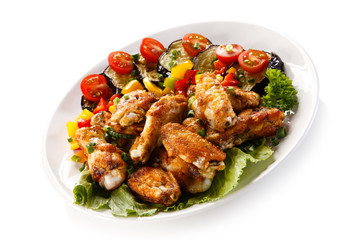 Grilled chicken wings and vegetables