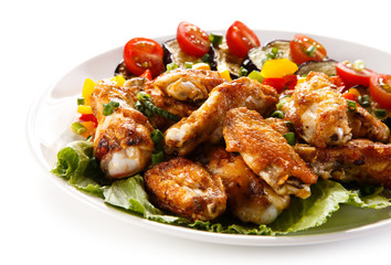 Grilled chicken wings and vegetables