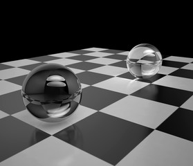 Two glass spheres on a chessboard
