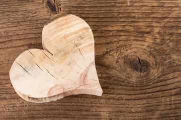 wooden heart on old wooden background