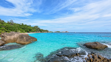 Obraz premium Beautiful landscape blue sky sea and waves on beach near the rocks during summer at Koh Miang island in Mu Ko Similan National Park, Phang Nga province, Thailand, 16:9 widescreen