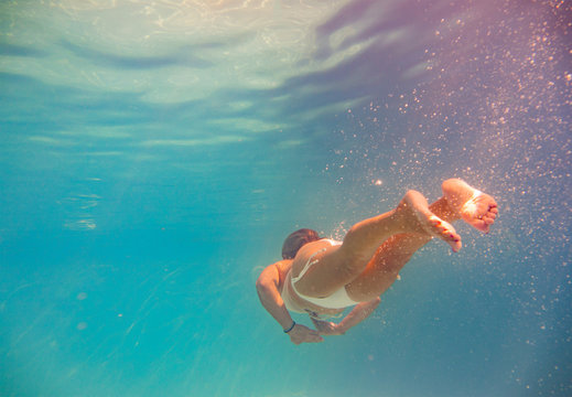 beautiful blonde girl underwater