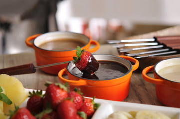 Fondue with strawberry, fruit and hot chocolate