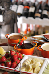 Fondue with strawberry, fruit and hot chocolate