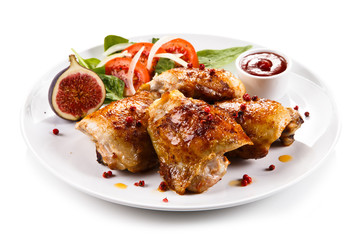 Roasted chicken drumsticks and vegetables