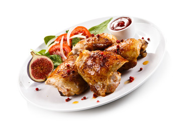 Roasted chicken drumsticks and vegetables