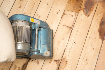 old plank floor and grinding machine with copy space