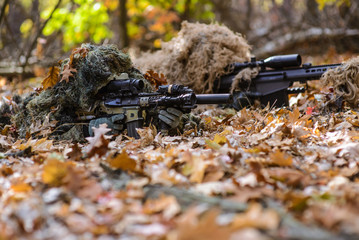 Team of snipers in the woods/Two snipers dressed in ghilly hiding in forest with rifles