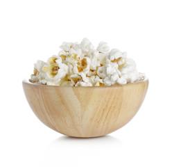 Popcorn in the Wooden Bowl isolated on white background
