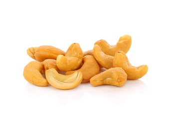 Roasted cashew nuts whith salt on white background