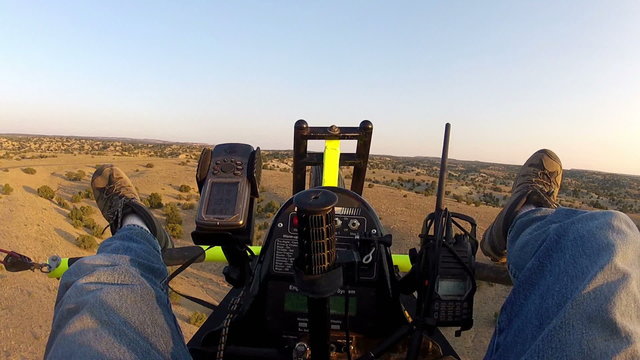 Ultralight pilot fly low over desert HD 039