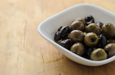 Mixed olives in white bowl
